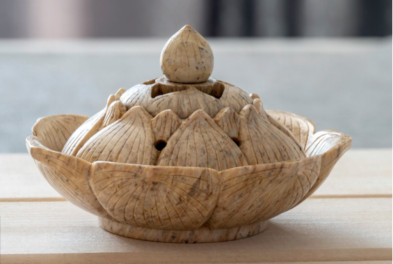 Lotus-shaped stone incense burner with delicate carved petals, symbolizing purity and serenity in traditional incense rituals.