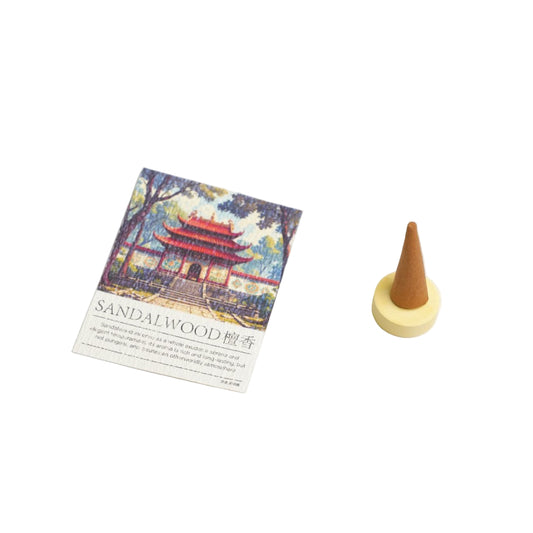 Sandalwood incense cone with packaging featuring a scenic design on a white background