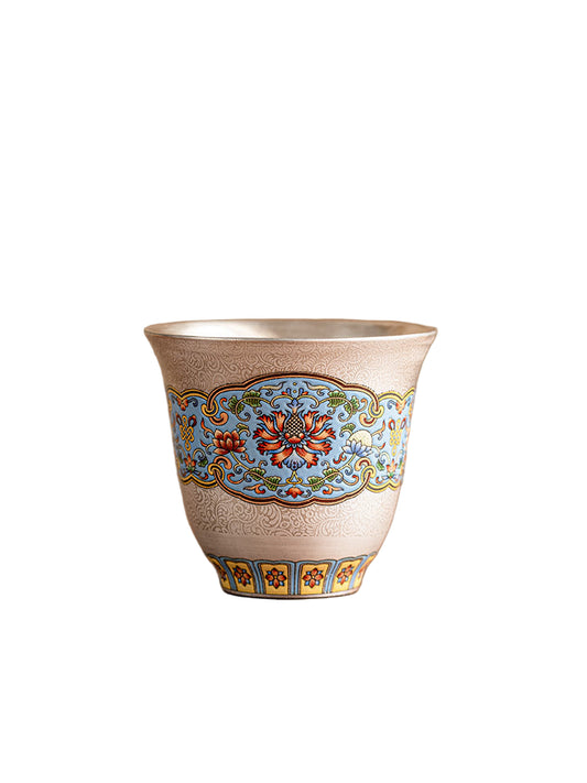 Decorative ceramic cup with intricate patterns on a wooden surface and brown background