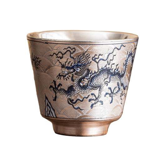 Ceramic cup with dragon design on a wooden surface