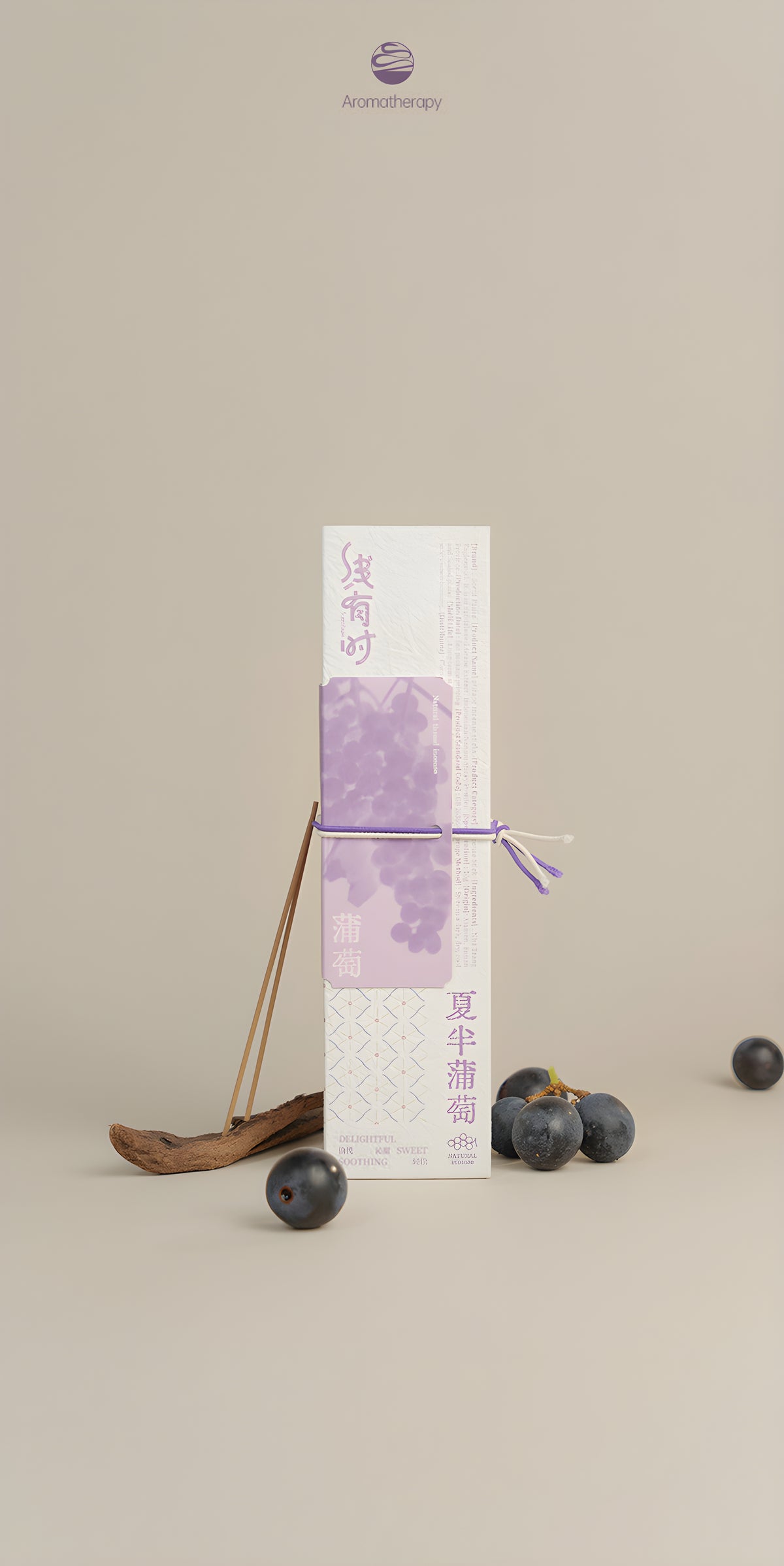 Cream-and-purple grape incense package tied with a purple cord and displayed with dark fruit and a wooden spoon.