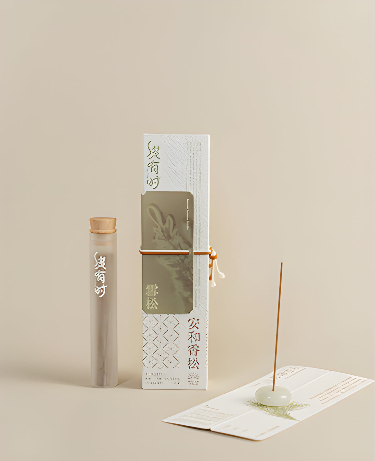 Cedar incense packaging and a slim storage tube beside an upright incense stick in a round holder.