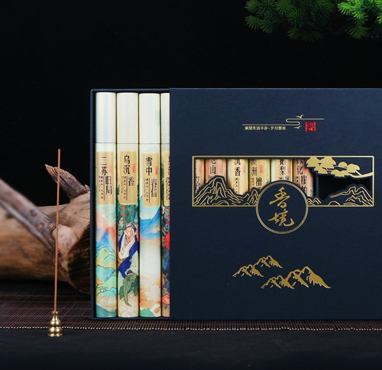 Set of books with decorative covers in a blue box on a dark background