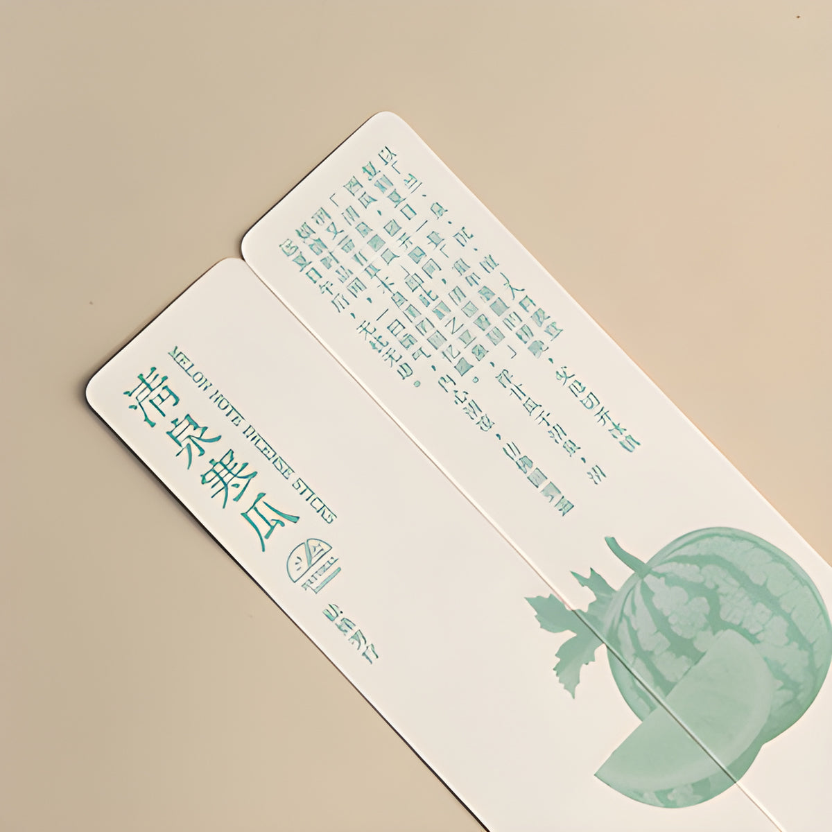 Watermelon illustration and teal lettering on the melon note incense packaging.