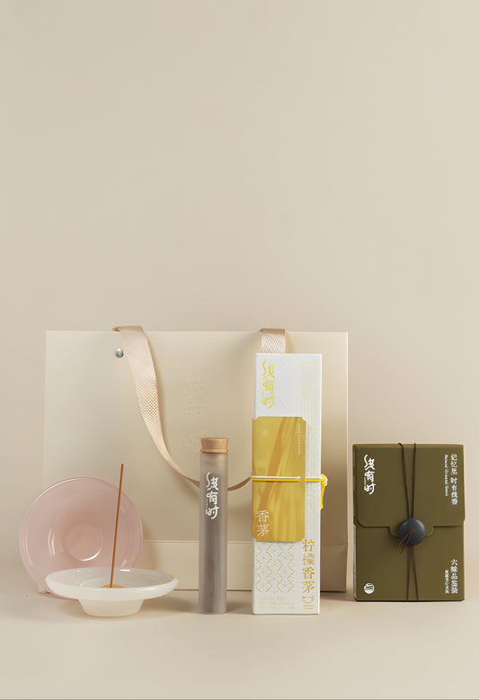 Incense Beginner Set with a yellow lemongrass incense box, six-scent sampler, burner and cream gift bag.