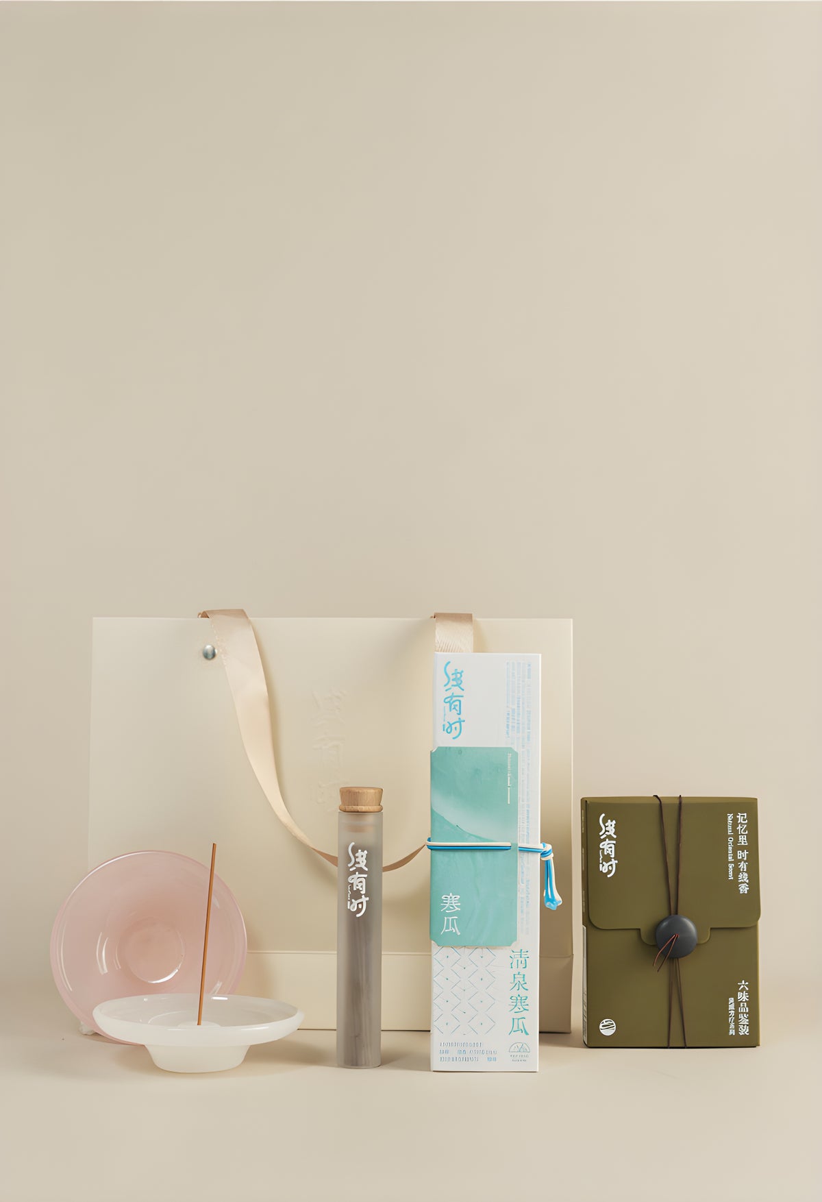 Incense Beginner Set with a turquoise melon incense box, six-scent sampler, burner and cream gift bag.