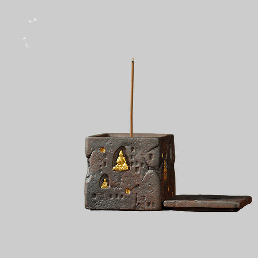 Incense burner with incense stick on a wooden surface, featuring MUYANTEA branding.
