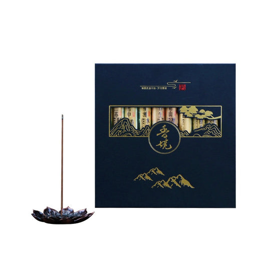 Incense stick with a decorative box featuring mountain designs on a white background
