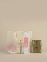 Incense Beginner Set with a pink rose incense box, six-scent sampler, burner and cream gift bag.