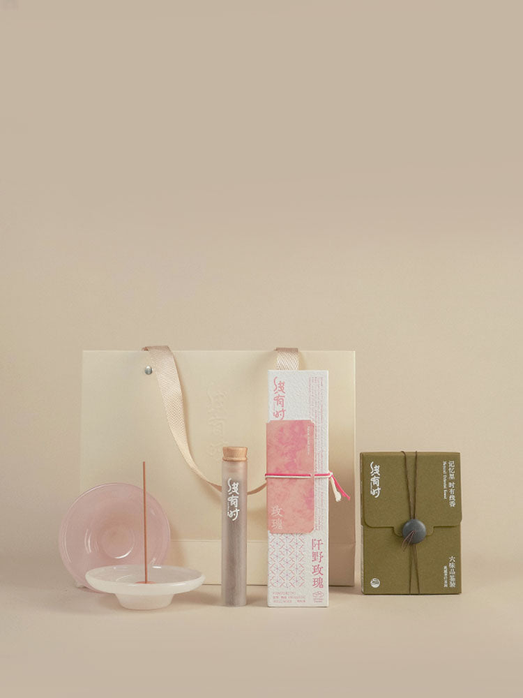 Incense Beginner Set with a pink rose incense box, six-scent sampler, burner and cream gift bag.
