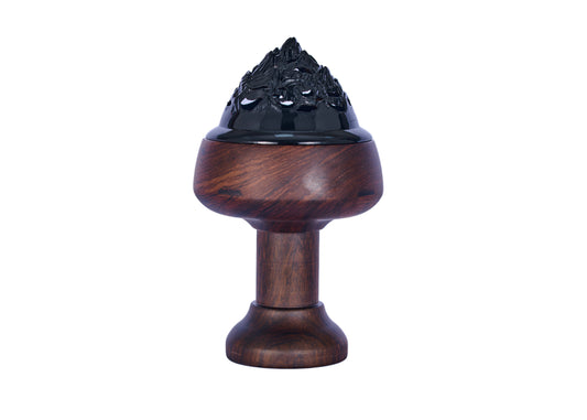 Wooden incense burner with black decorative top on a white background