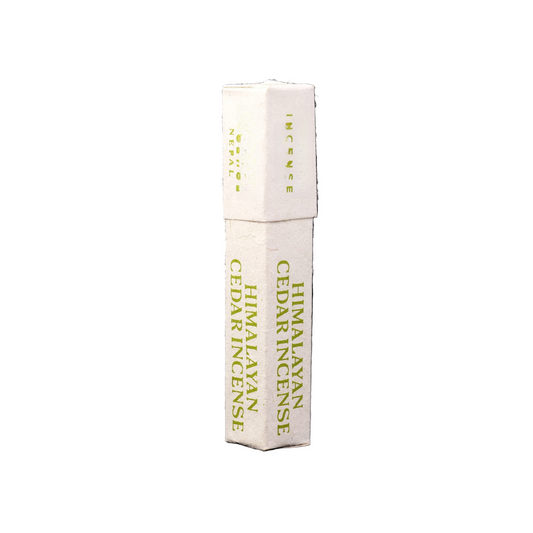 Himalayan Cedar Incense packaging on a black background