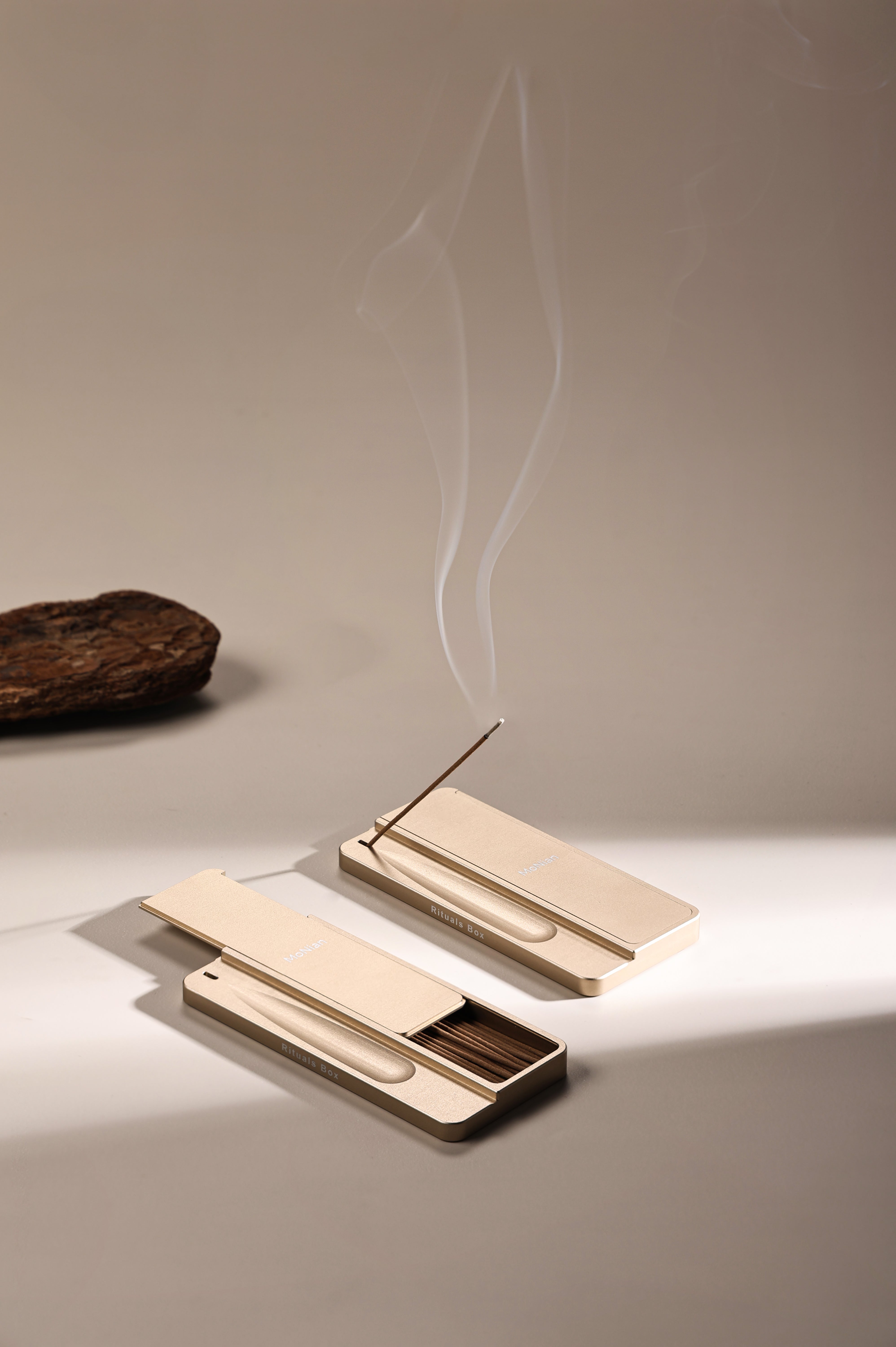 Monian Rituals Box champagne gold aluminum incense holder with smoke rising — portable meditation tool