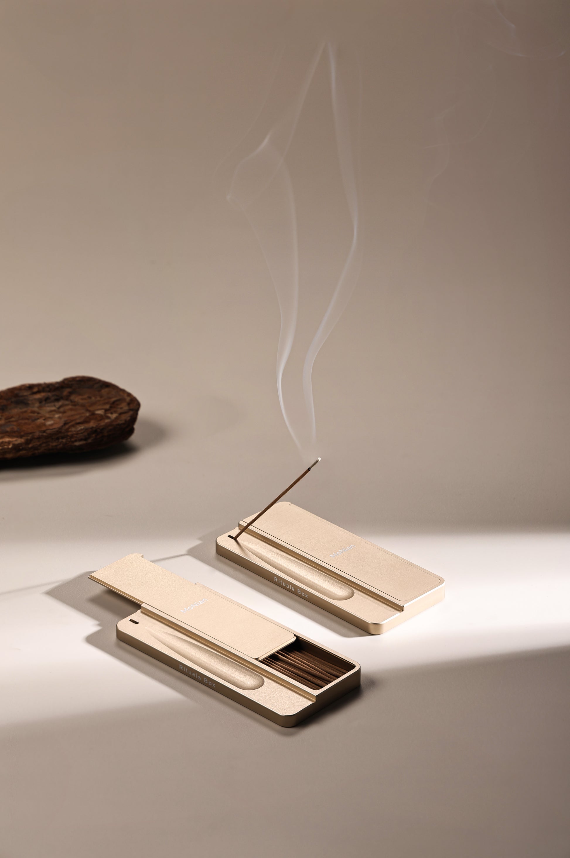 Monian Rituals Box champagne gold aluminum incense holder with smoke rising — portable meditation tool
